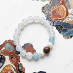 Snowbound Moonrise White Moonstone & Aquamarine Bracelet with Handcrafted Tibetan Incense Bead